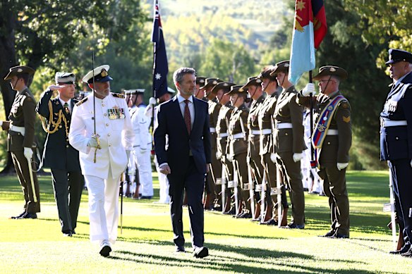 King Frederik X of Denmark inspects the Guard of Honour during a ceremonial welcome.