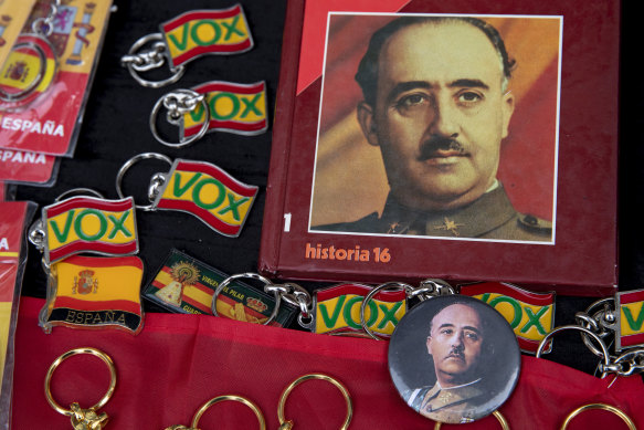 Souvenirs for sale with Francoist symbology next to key chains of the far-right Vox party in November 2019, marking the 44th anniversary of former dictator Francisco Franco’s death in 1975. 