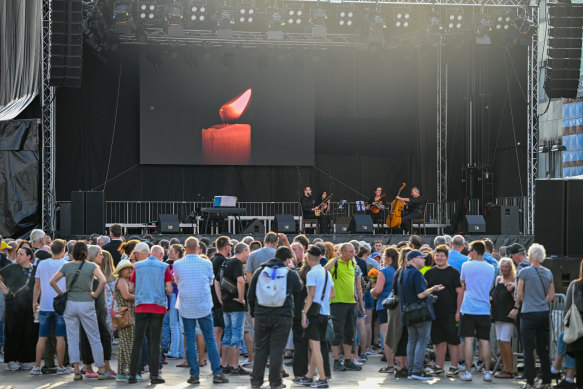 People take part in a memorial service for the victims of the attack in Solingen, Germany.