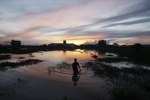 A man catches fish in Chres village on the outskirts of Phnom Penh.