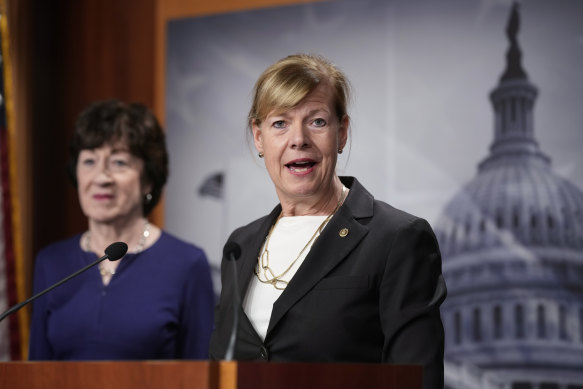 Senator Tammy Baldwin joined at left by Senator Susan Collins speaks to reporters following Senate passage of the Respect for Marriage Act, at the Capitol.