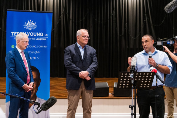 Then-prime minister Scott Morrison and MPs Paul Fletcher with Longman MP Terry Young (speaking).