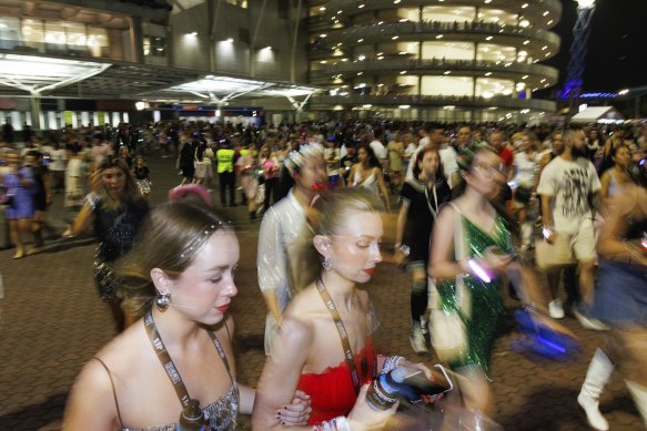 Taylor Swift fans on their way home from Accor Stadium.