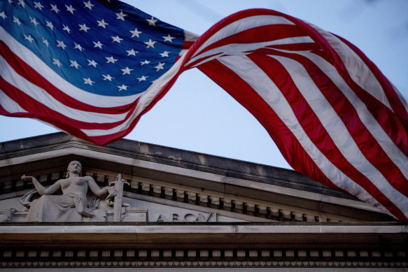 An American flag flies outside the Department of Justice in Washington DC. 