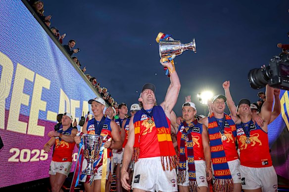 Brisbane’s Harris Andrews holds the 2026 premiership cup aloft on Saturday. 
