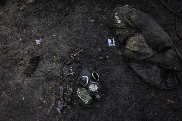 A destroyed mask and other gear left at the site where as many as nine Russian tanks and armored vehicles were destroyed on a forest road outside Dmytrivka, Ukraine, west of Kyiv .