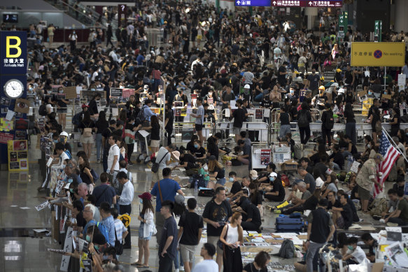 Protesters stage a sit-in rally at the arrival hall of the Hong Kong International Airport.