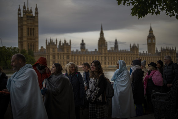 Mourners wrapped in blankets reach the final stages of the queue for the Queen’s lying-in-state.