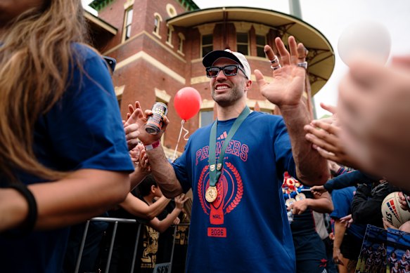 Still the No. 1: James Tedesco is swarmed by fans at the SCG on Monday.