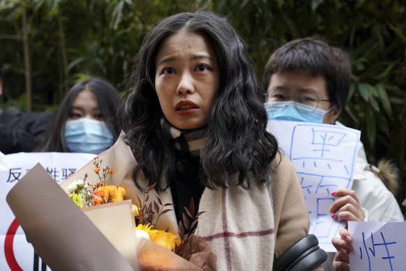 Prominent MeToo figure Zhou Xiaoxuan speaks to her supporters as she arrives at a courthouse in Beijing in December. 
