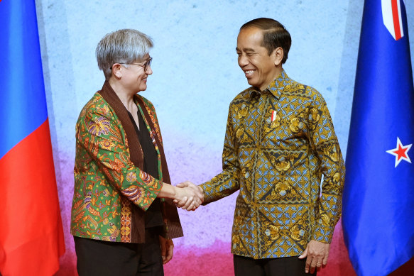 Wong greets Indonesian President Joko Widodo in Jakarta on Friday.