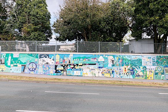 The mural outside Greenslopes State School celebrating the school’s centenary.