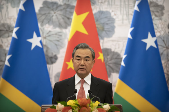 Chinese Foreign Minister Wang Yi at a ceremony marking the establishment of diplomatic relations between the Solomon Islands and China in 2019.