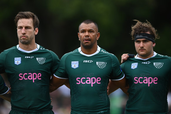 Kurtley Beale lines up for a minute’s silence before Saturday’s game in Brisbane.