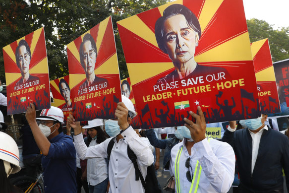Engineers hold posters with an image of deposed Myanmar leader Aung San Suu Kyi as they hold an anti-coup protest march in Mandalay.
