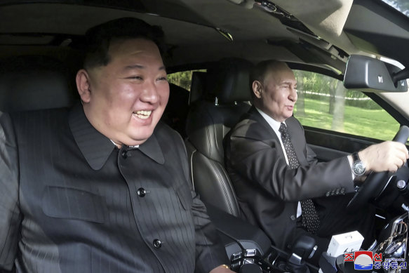 Russia’s President Vladimir Putin, right, drives a car in Pyongyang, with North Korean leader Kim Jong-un in July.