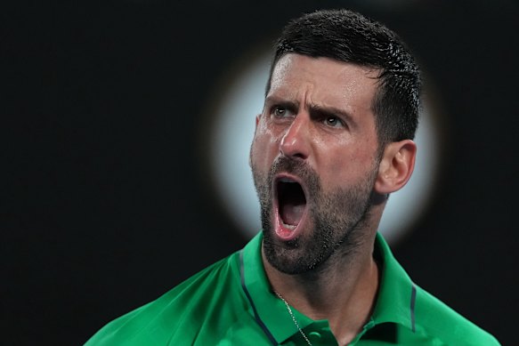 Novak Djokovic of Serbia reacts during his semifinal match against Jannik Sinner of Italy.