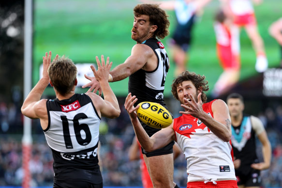 Scott Lycett clashes with Tom Hickey.