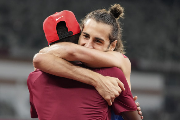 Barshim and Tamberi embrace after winning gold.