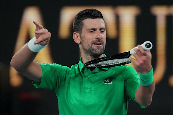 Novak Djokovic’s reaction after winning on a heated night at Melbourne Park in more ways than one? To play the racquet violin.