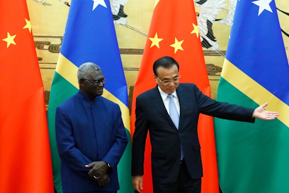 Former Solomon Islands prime minister Manasseh Sogavare, left, was regarded as the most pro-China leader in the Pacific. 