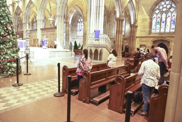 Worshippers keep their distance at St Mary's Cathederal on Wednesday.