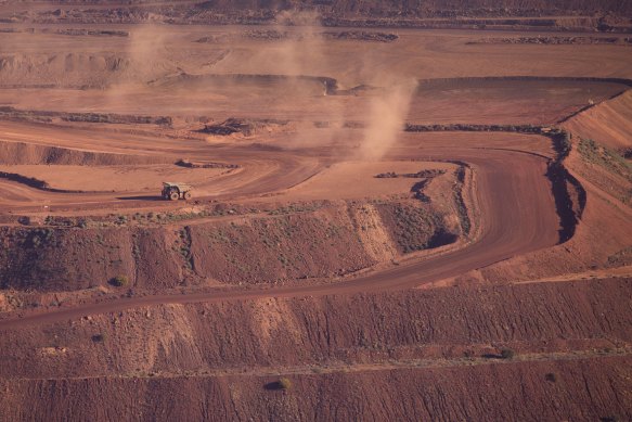 An iron ore truck drives through the Rio Tinto Marandoo mine site on the outskirts of Karijini National Park in Western Australia.
