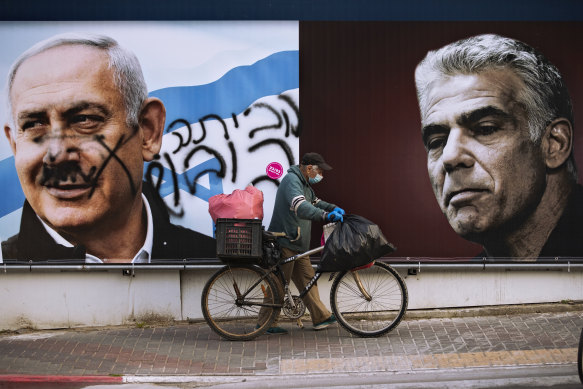 A campaign billboard for the Likud party shows a portrait of its leader Prime Minister Benjamin Netanyahu, left, and opposition leader Yair Lapid.