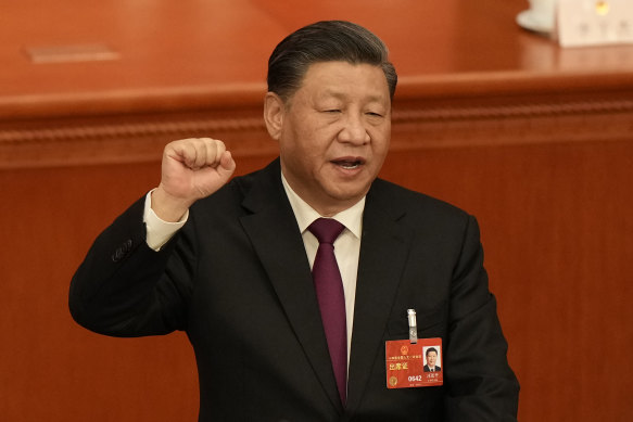 Chinese President Xi Jinping takes his oath after he is unanimously elected as President during a session of China’s National People’s Congress.