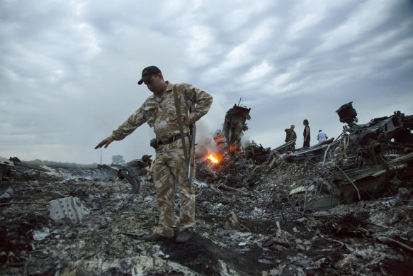 Officers at the MH17 crash site in Ukraine.