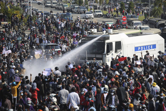 Police spray water cannon on a crowd in Nay Pyi Taw on February 8.