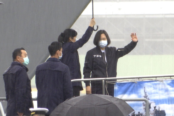 Taiwanese President Tsai Ing-wen, right, boards a guided-missile frigate in the northern port of Keelung, Taiwan, last month to thank personnel for their dedication to protect the island.