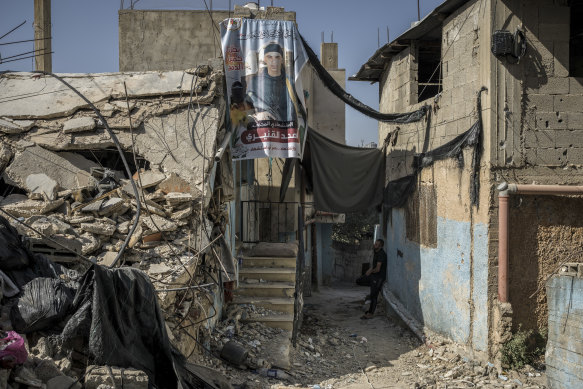 A banner featuring a fighter in Jenin, West Bank.