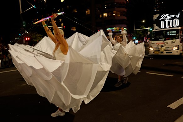 Flower girls in the wedding-themed float.