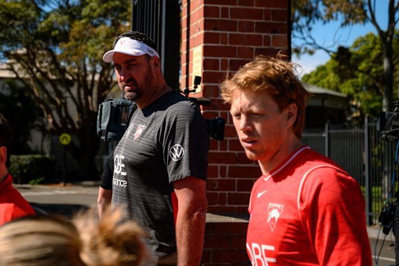 Coach Dean Cox and captain Callum Mills arrive at Swans training. 