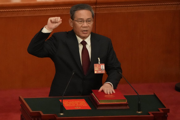 Newly elected Chinese Premier Li Qiang takes his oath during a session of China’s National People’s Congress.