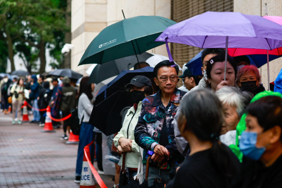 Huge crowds queue for public gallery seats outside Hong Kong’s West Kowloon Magistrates’ Court for the sentencing of 45 pro-democracy activists including Australian citizen Gordon Ng.