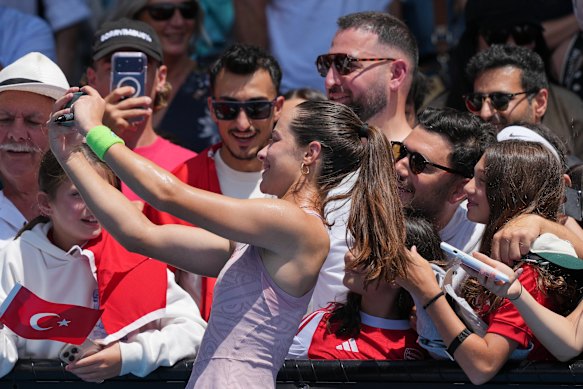 Zeynep Sonmez takes a selfie with Turkish supporters following her second round win.