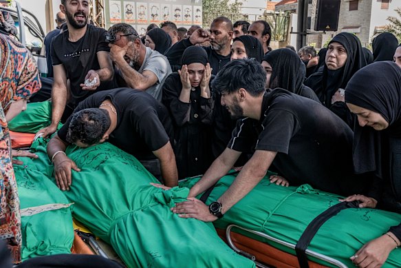 The funeral of eight family members killed in an Israeli strike on southern Lebanon earlier this month. 