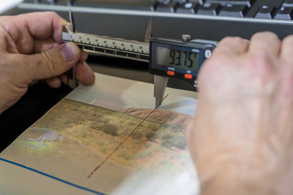 The document includes UV visible printing and holograms, and invisible printing that fluoresces strongly.