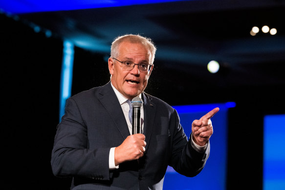 Prime Minister Scott Morrison speaking to party faithful yesterday at The NSW Liberal Party Rally at Accor Stadium. 