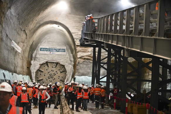 Workers, politicians and media at the new Victoria Cross Metro Station site at North Sydney in August last year