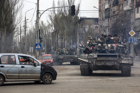 Russian tanks roll along a street in an area controlled by Russian-backed separatist forces in Mariupol on Saturday.