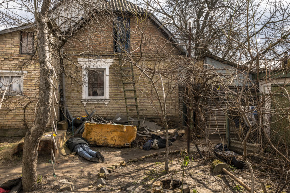 The bodies of three civilians in the garden of a house in Bucha, Ukraine, April 4, 2022.