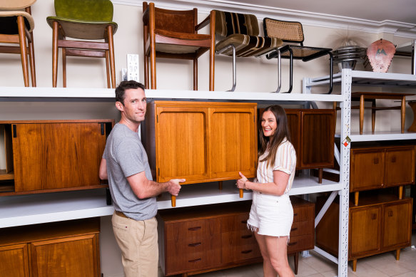 Jessica Cale, right, and her husband, Joel, with their pieces at Retro Bay resellers.