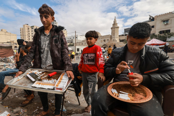 Palestinian youths sell cigarettes on a main square in Khan Younis in November.