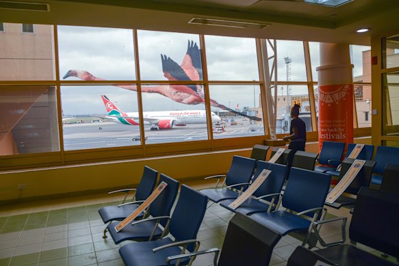Passenger gate livened with a large flamingo window decal.