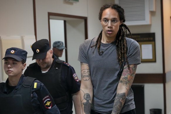 WNBA star and two-time Olympic gold medallist Brittney Griner is escorted from a courtroom.