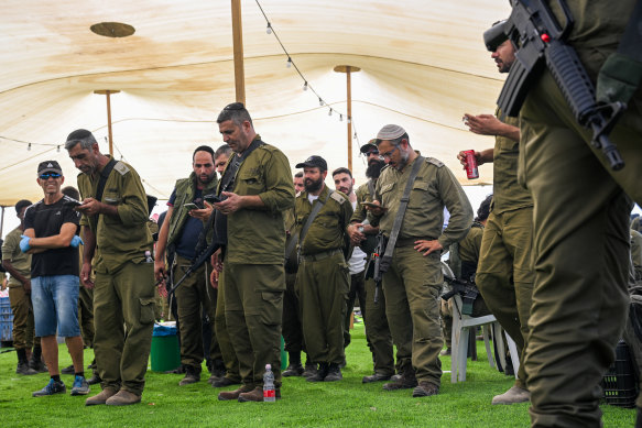 Israeli soldiers observe the Mincha afternoon prayer in southern Israel.