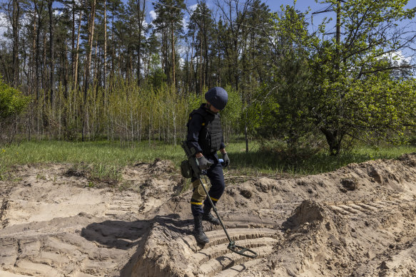 A Ukrainian demining specialist clearing anti-tank mines in Horenka, north of Kyiv, Ukraine.